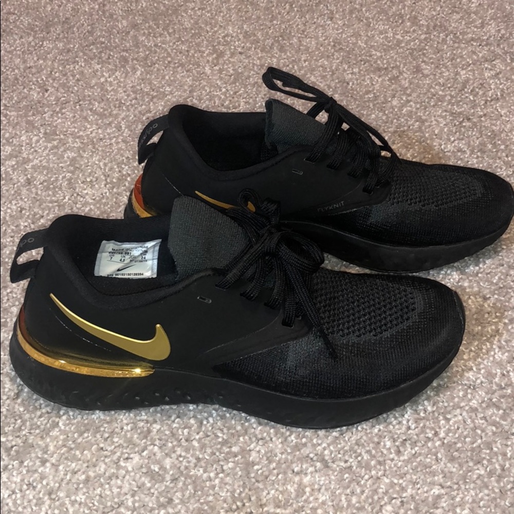 Nike black and gold sneakers. Size 7